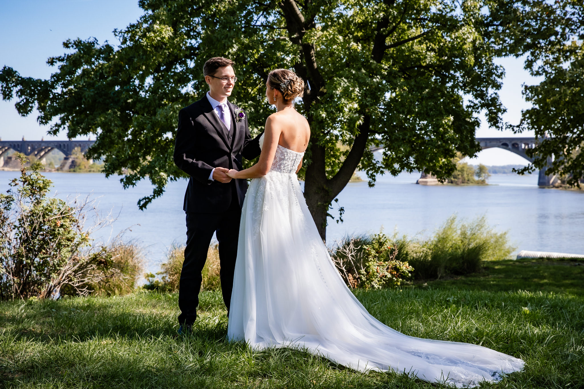 Couple enjoys their first look moment in a private spot near the Susquehanna River.