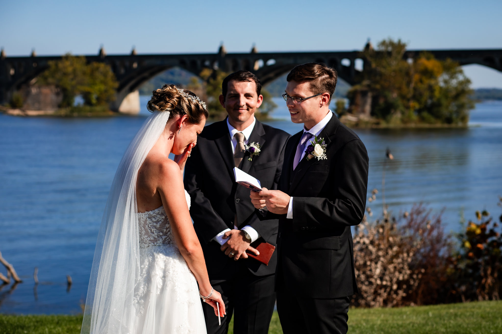 Groom reading vows, bride tears up for a special moment