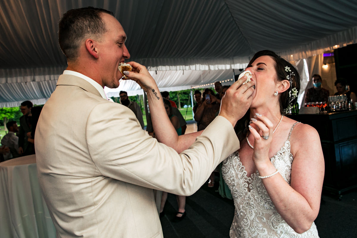 Fun wedding moment with couple being playful and carefree, shot by a York PA wedding photographer