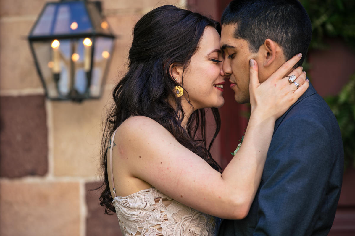 Soft lean in for a kiss with newly married couple