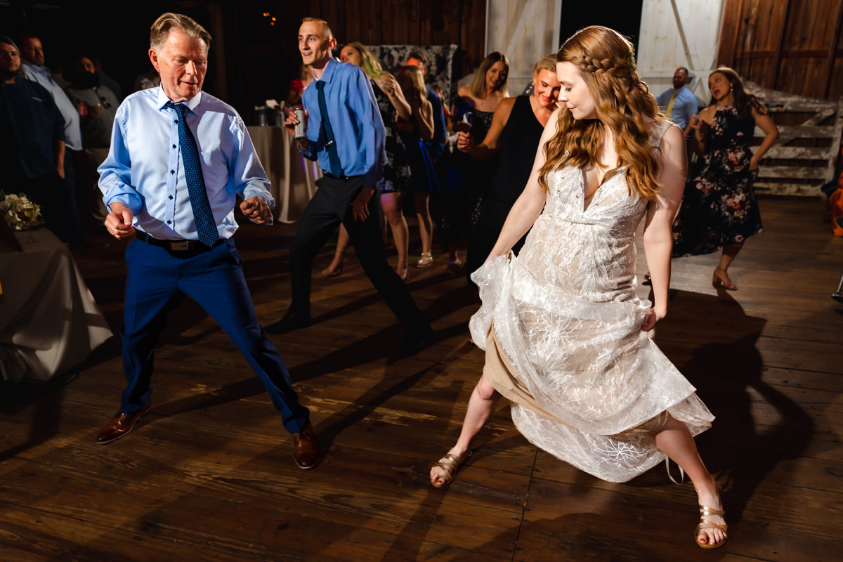 Bride dancing joyfully at the reception, captured by a York PA wedding photographer