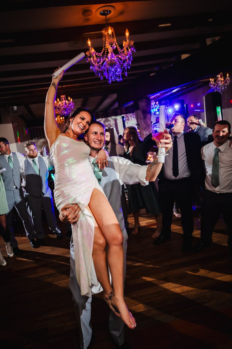 Couple dancing joyfully at their reception, captured by a York PA wedding photographer
