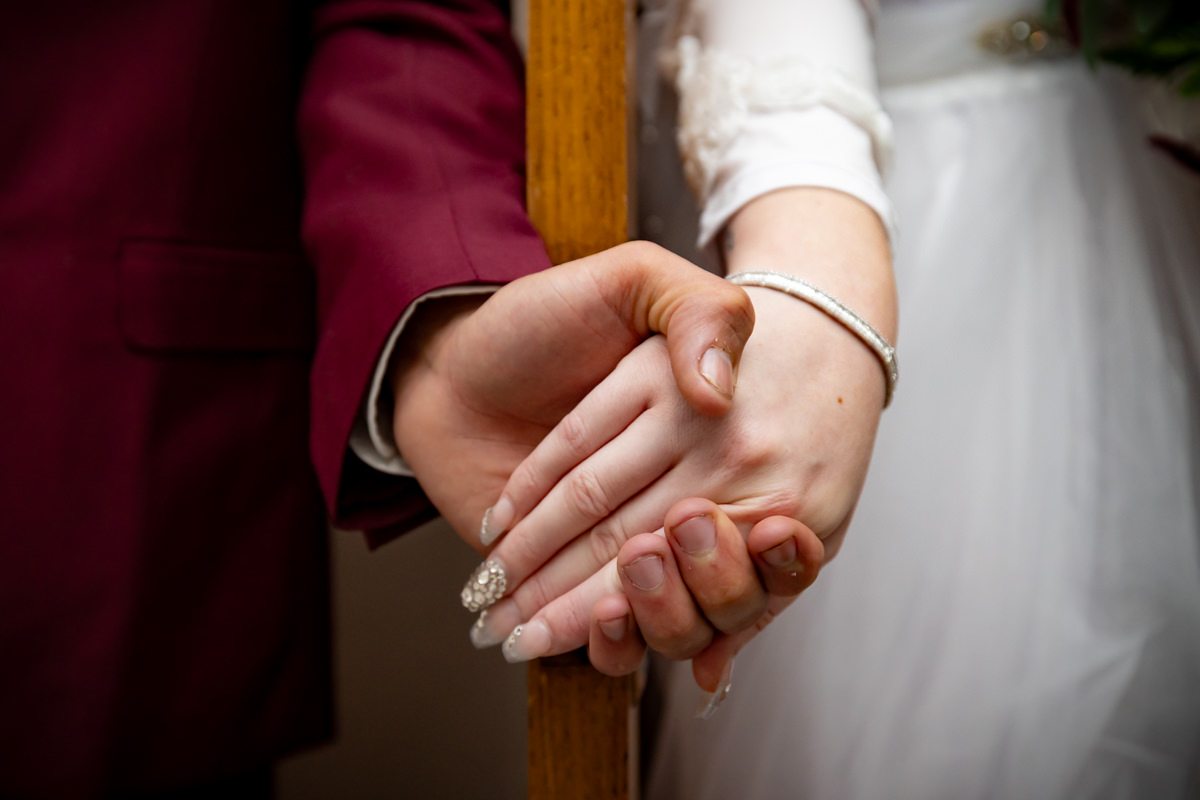 Bride and groom holding hands before the ceremony at their Brown’s Orchard wedding
