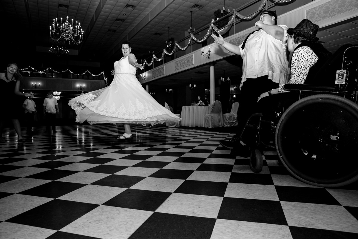 Bride twirling on the dance floor as her gown flows elegantly at her Wisehaven Event Center Wedding