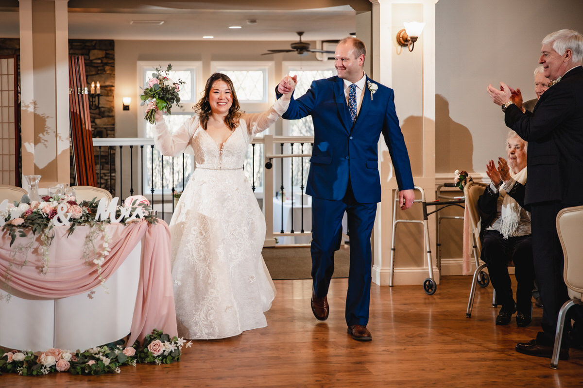 Couple's grand entrance into the Carriage House for their reception