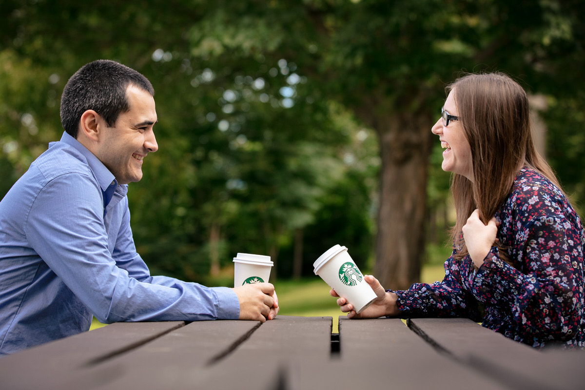 Mariah and Chris enjoying their Starbucks coffee at a picnic table